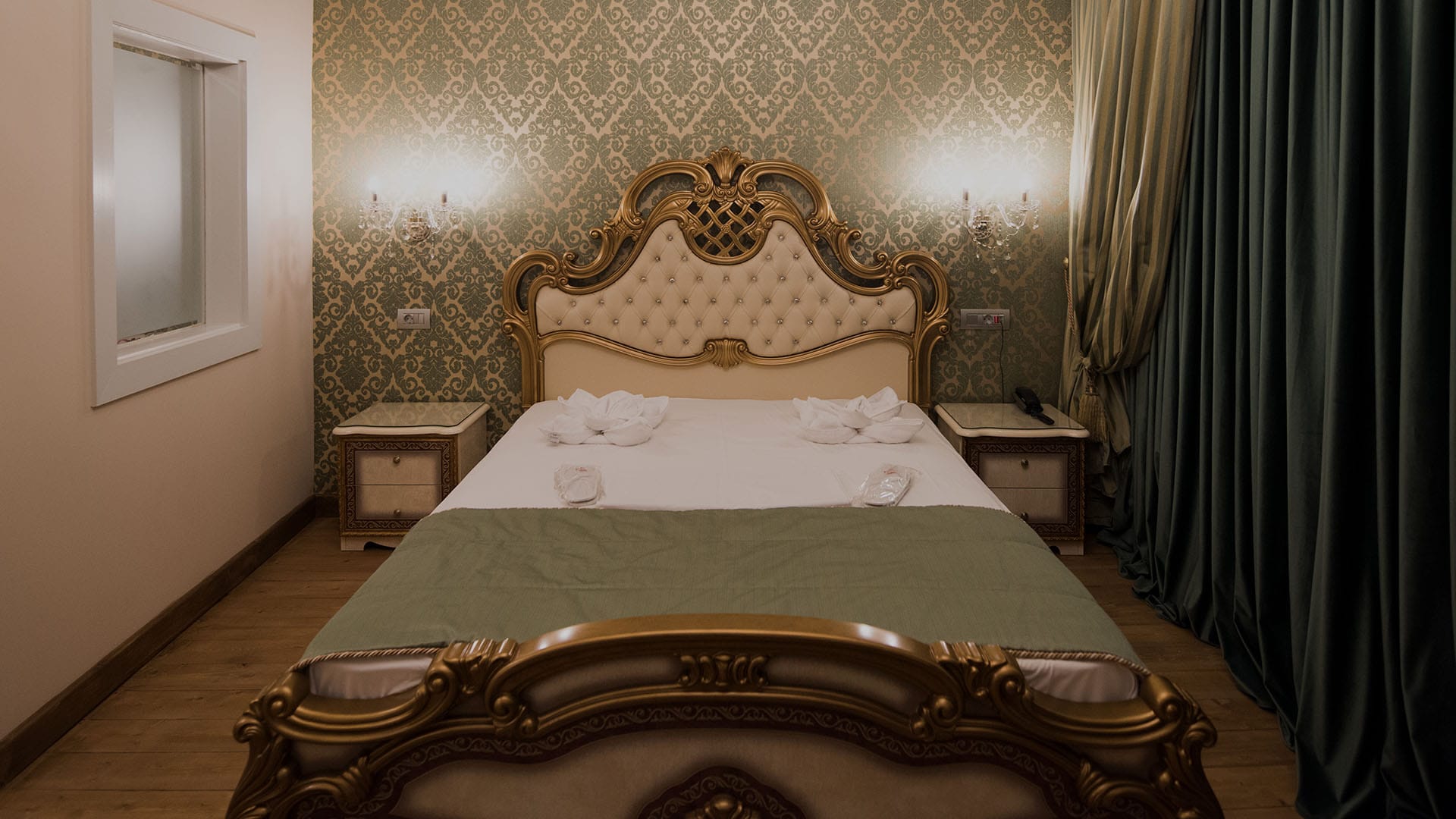 a bed with a gold headboard