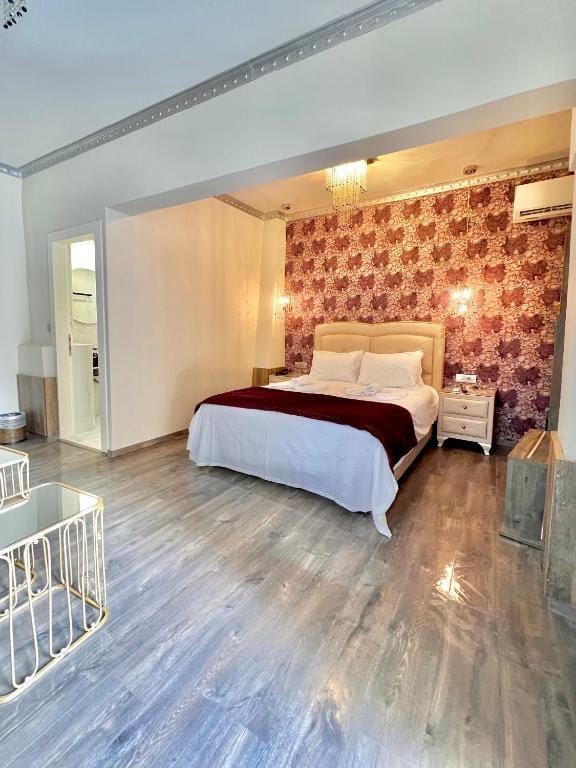 a bedroom with a bed and a heater