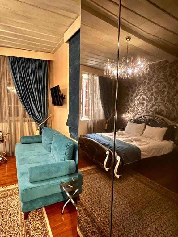 a bedroom with a bed and a chair