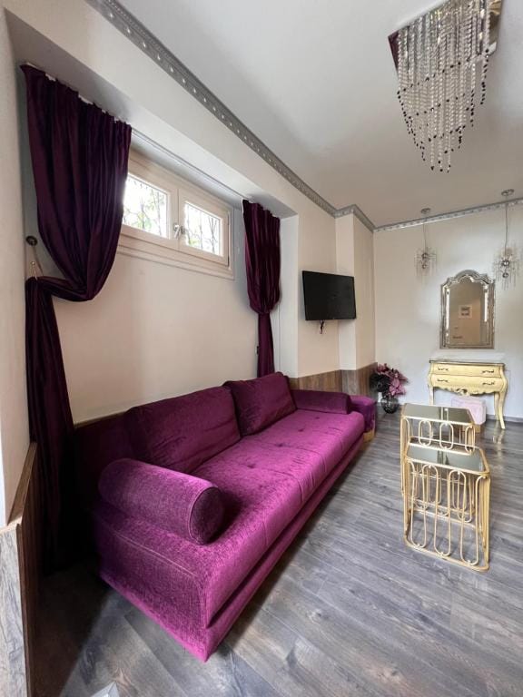 a room with a couch and a mirror