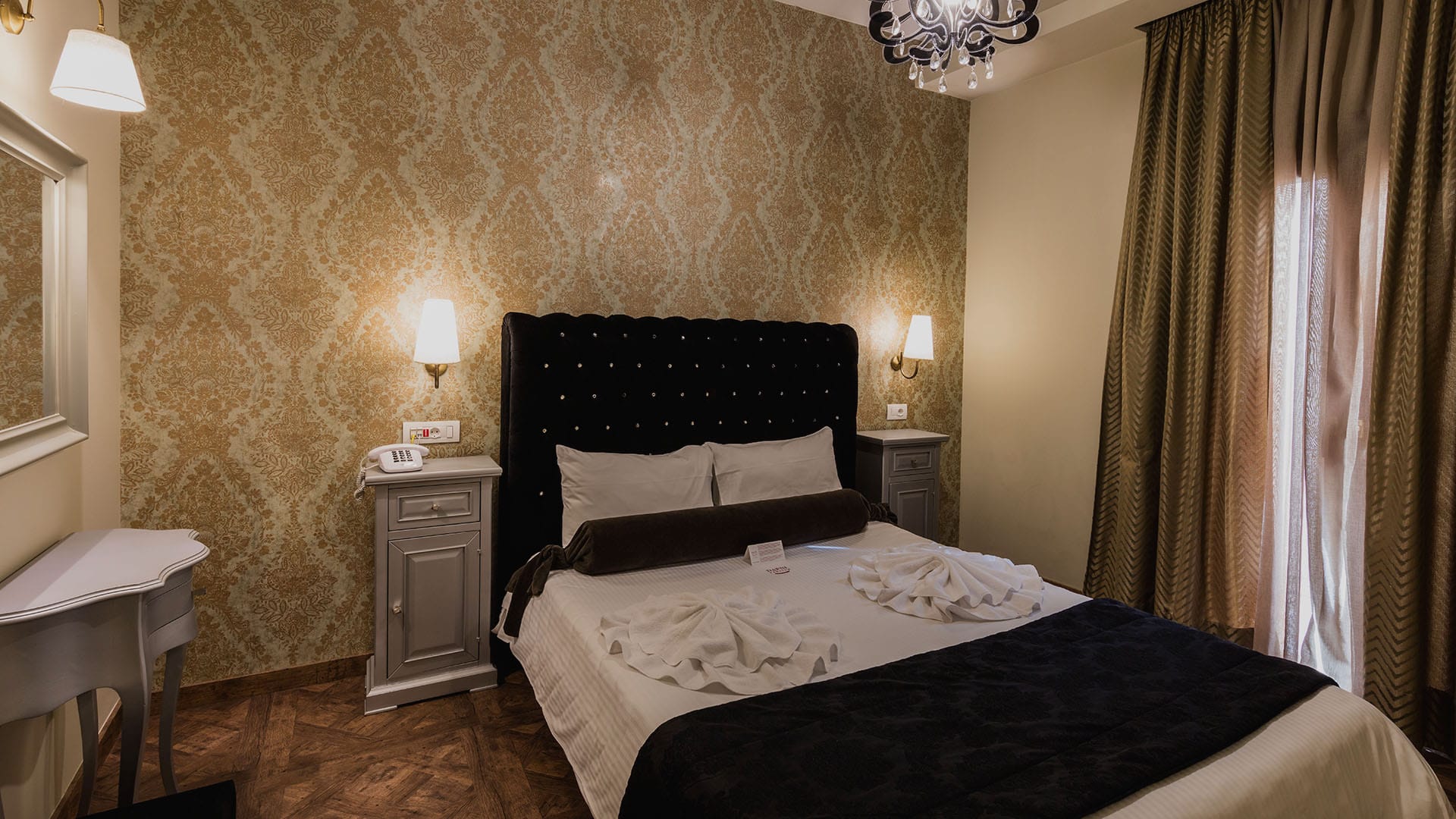 a bed with a black and white comforter