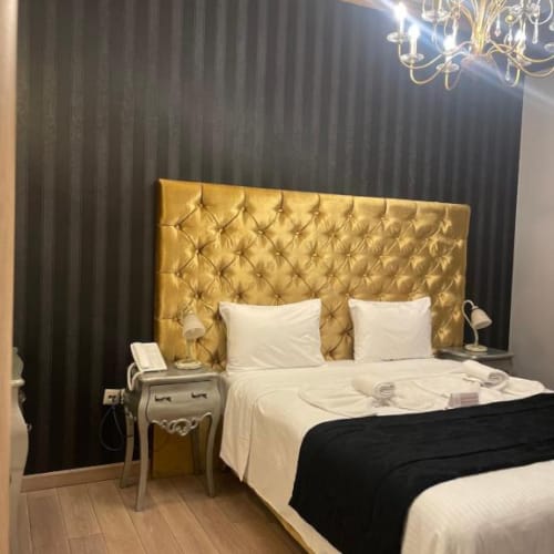 a bed with a large headboard