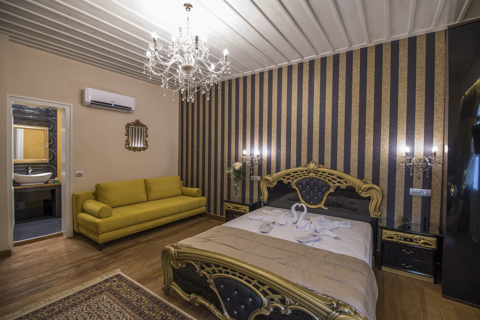 a bedroom with a bed and a couch