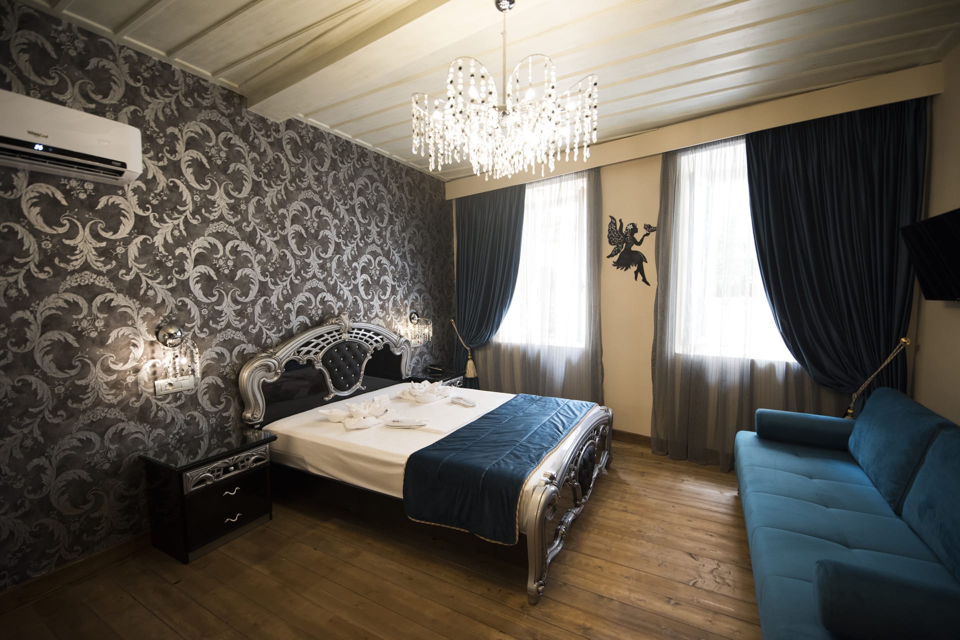 a bedroom with a bed and a couch