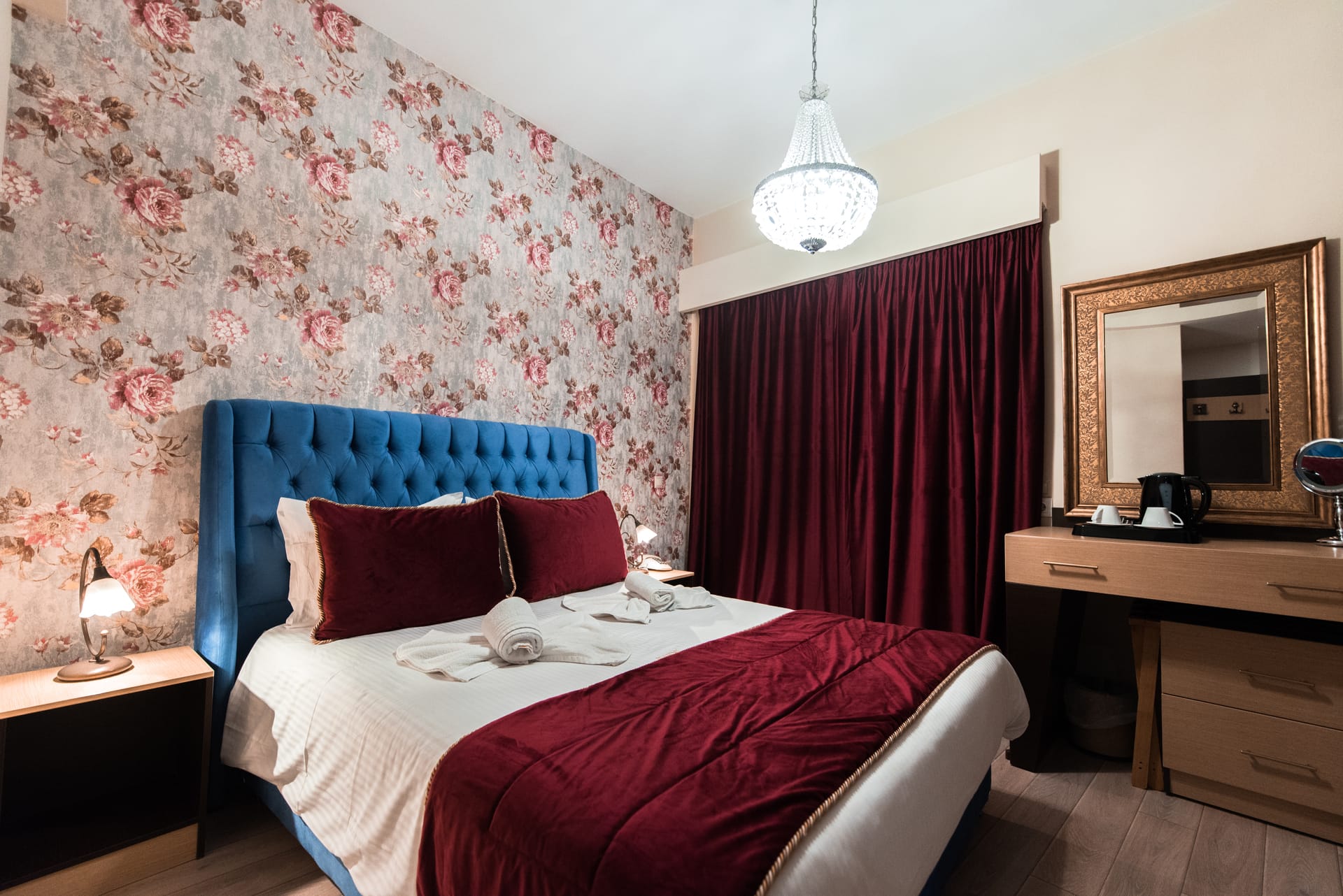 a bedroom with a bed and a mirror