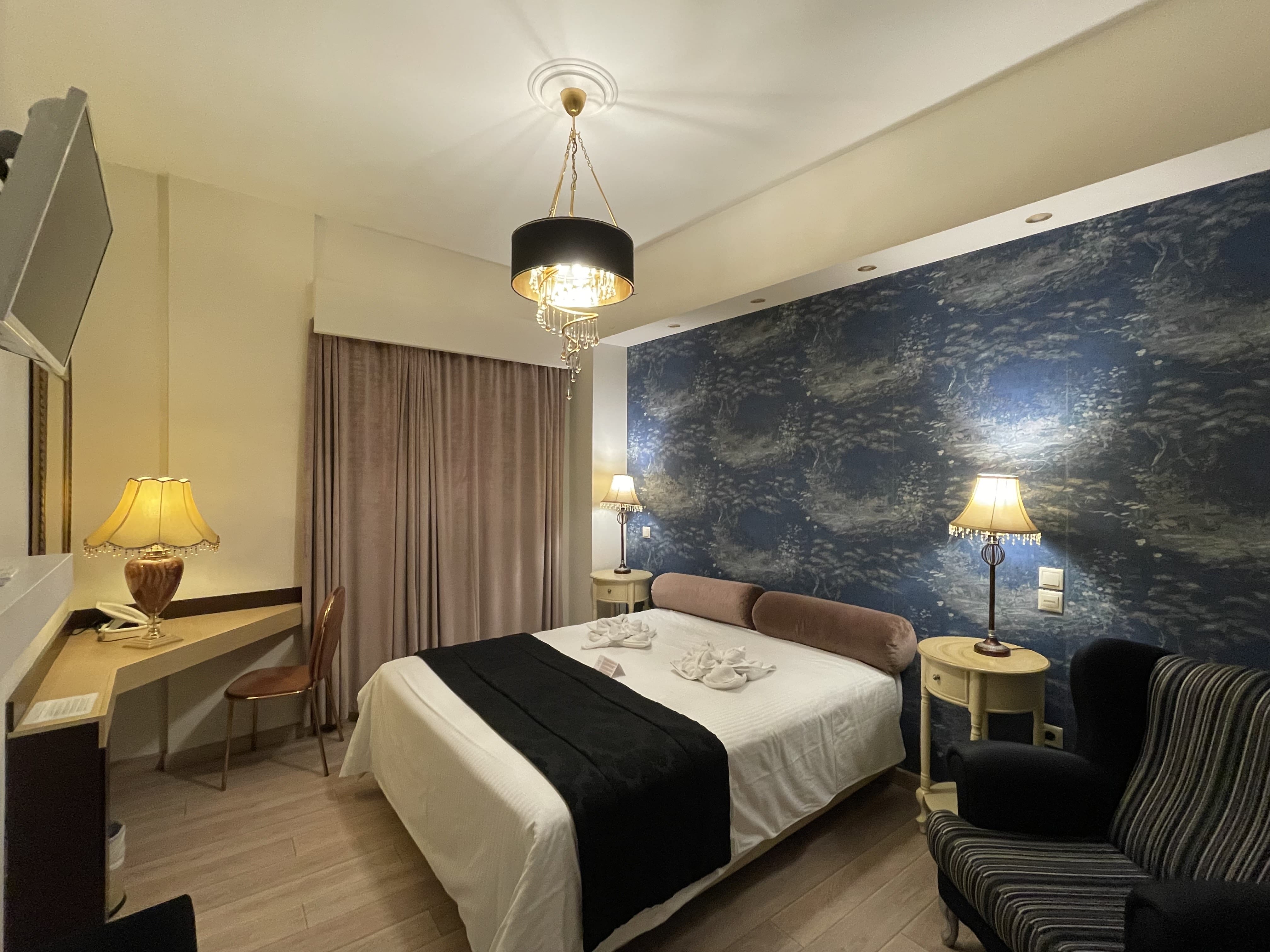 a bedroom with a bed and a desk