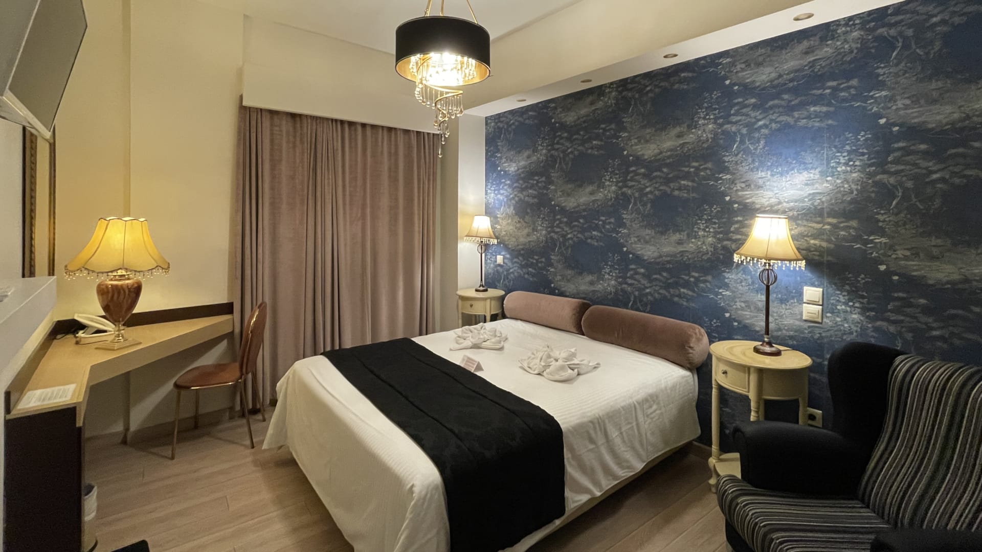 a bedroom with a bed and a desk