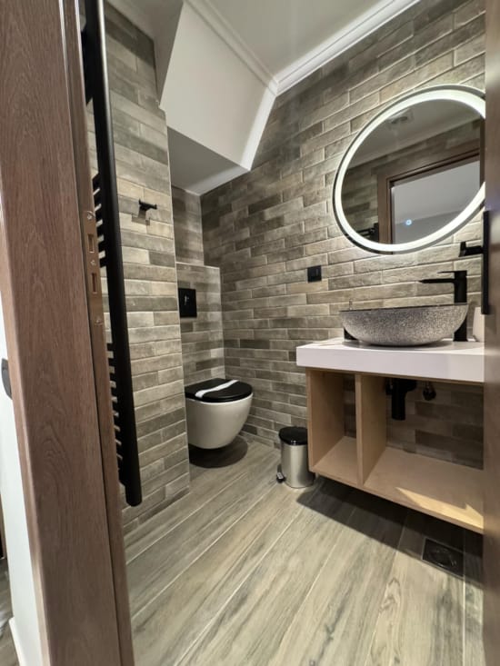 a bathroom with a large mirror