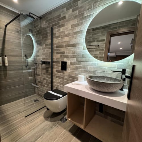 a bathroom with a glass shower