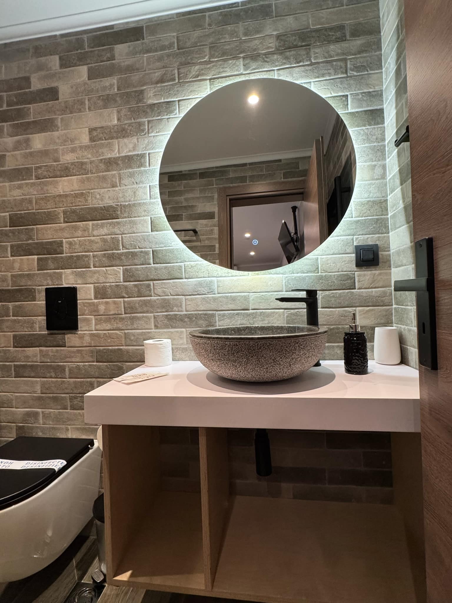 a bathroom with a large mirror