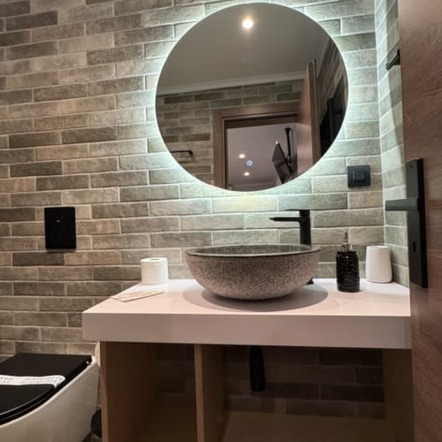 a bathroom with a large mirror