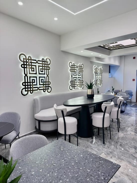 a dining room with a table and chairs