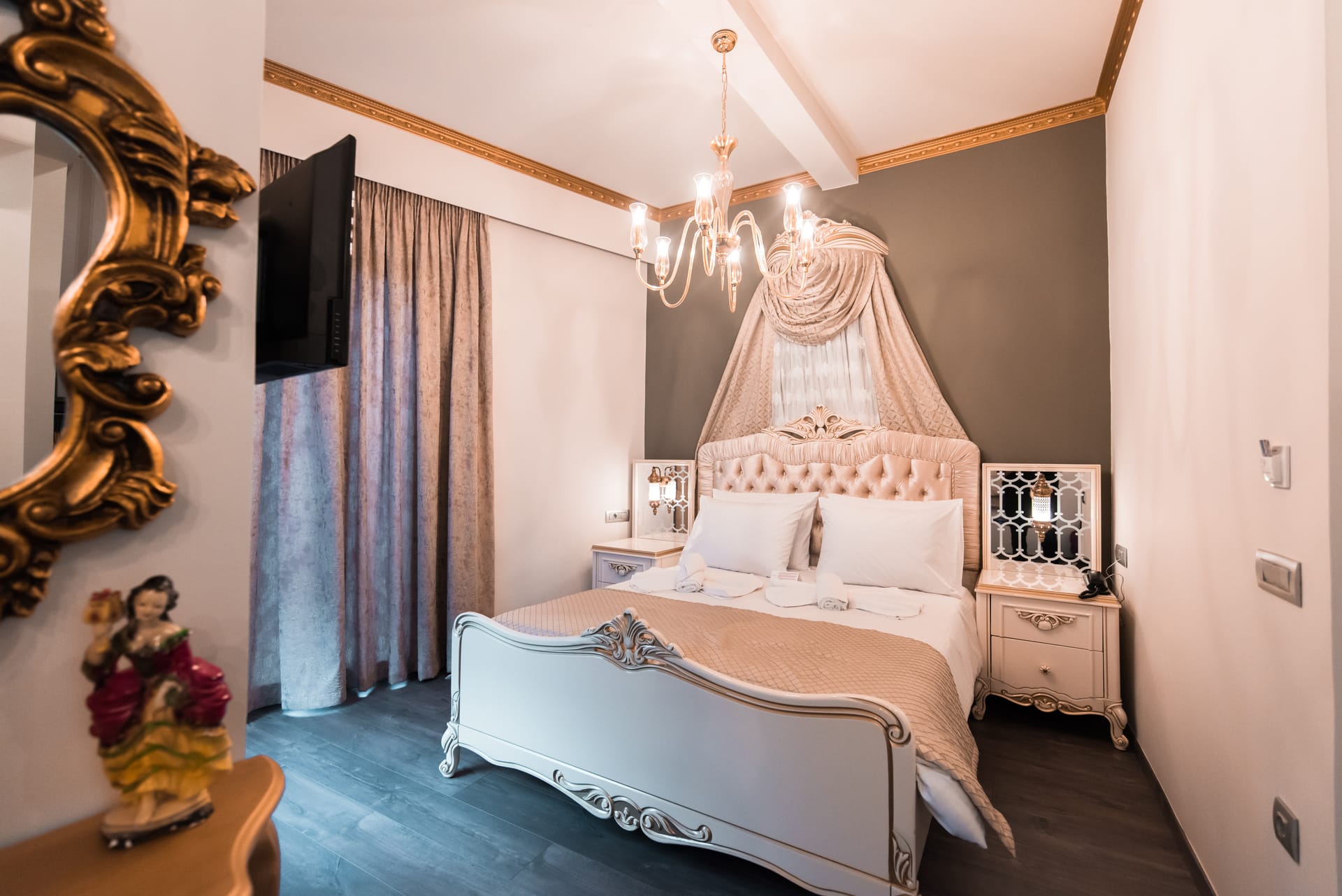 a bedroom with a bed and a mirror