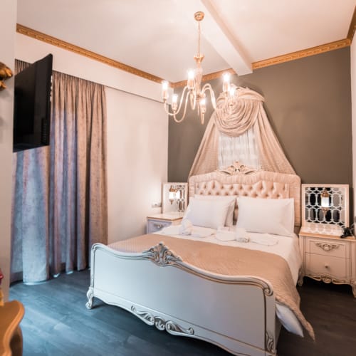 a bedroom with a bed and a mirror