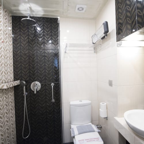 a bathroom with a shower and sink