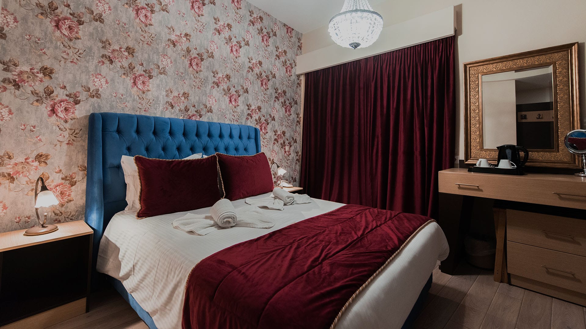 a bedroom with a bed and a mirror