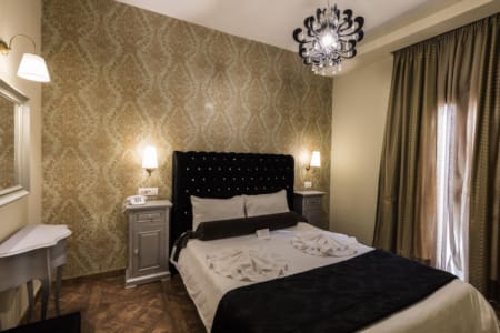 a bedroom with a bed and a table