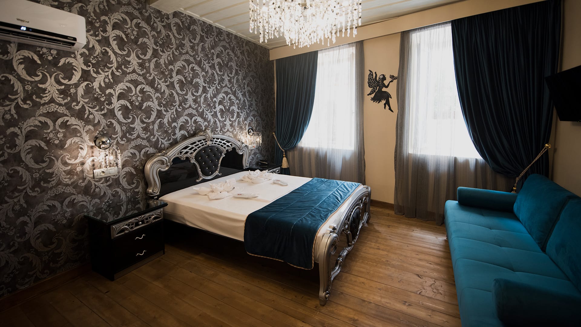 a bedroom with a bed and a couch