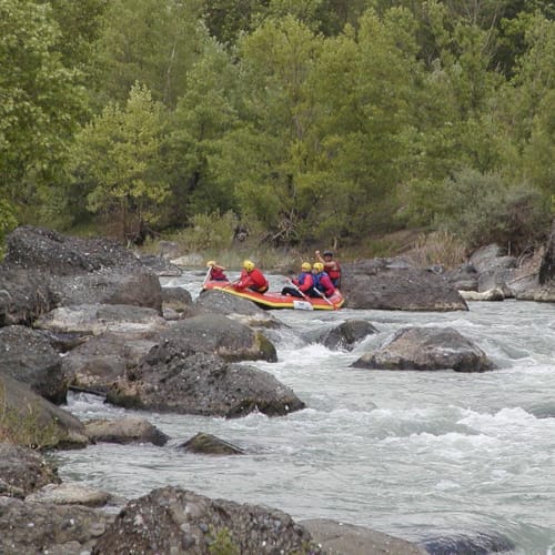 a group of people in a canoe on a river