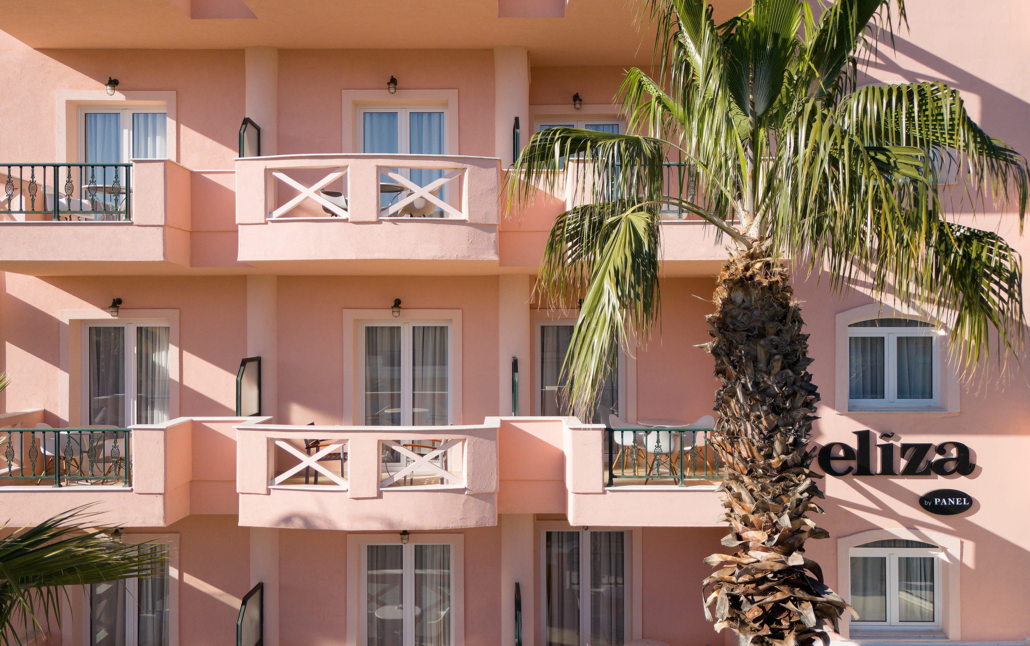a building with palm trees