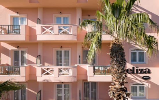 a building with palm trees