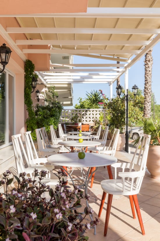 a patio with tables and chairs