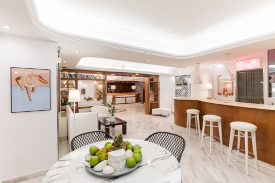 a dining room with a table and chairs