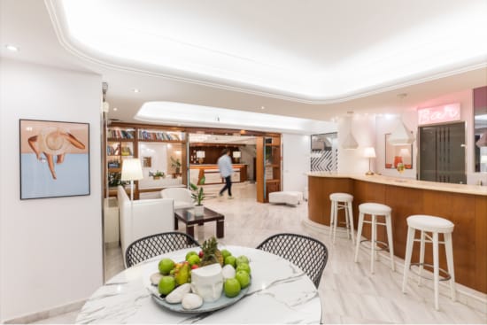 a dining room with a table and chairs