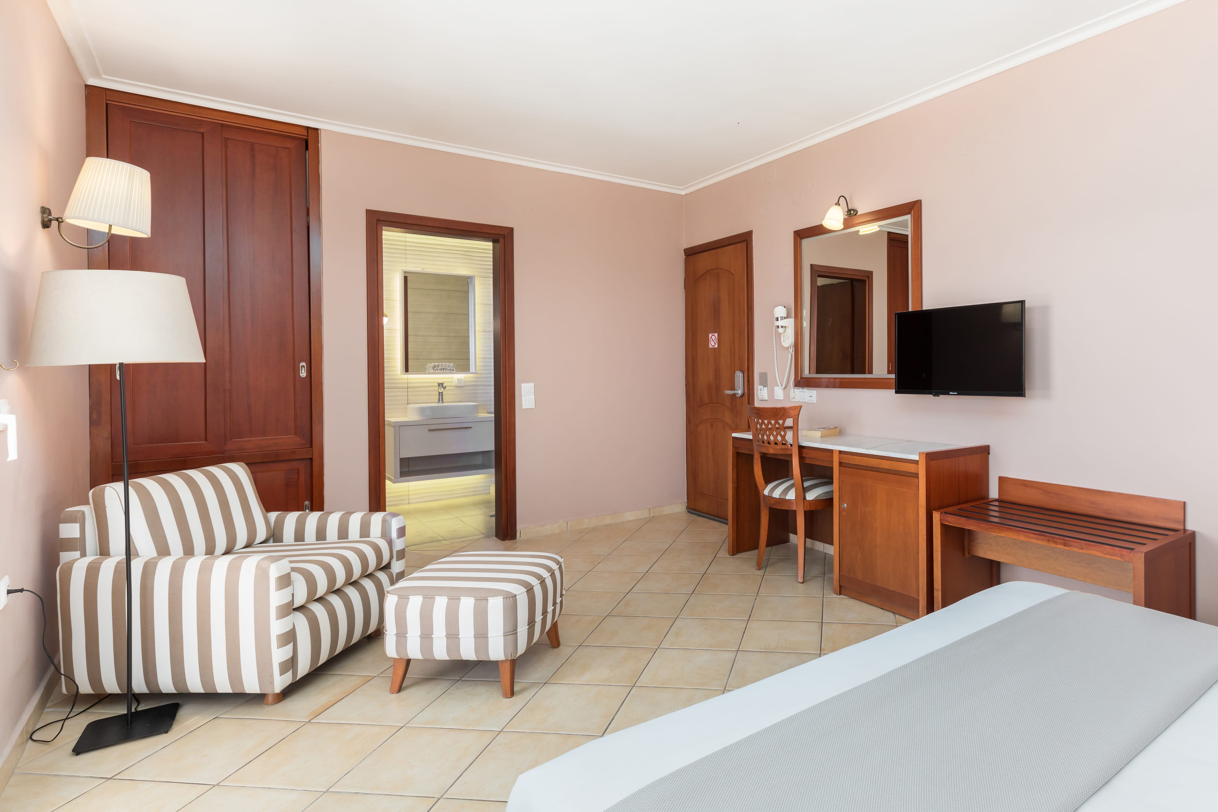 a living room with a couch and a tv