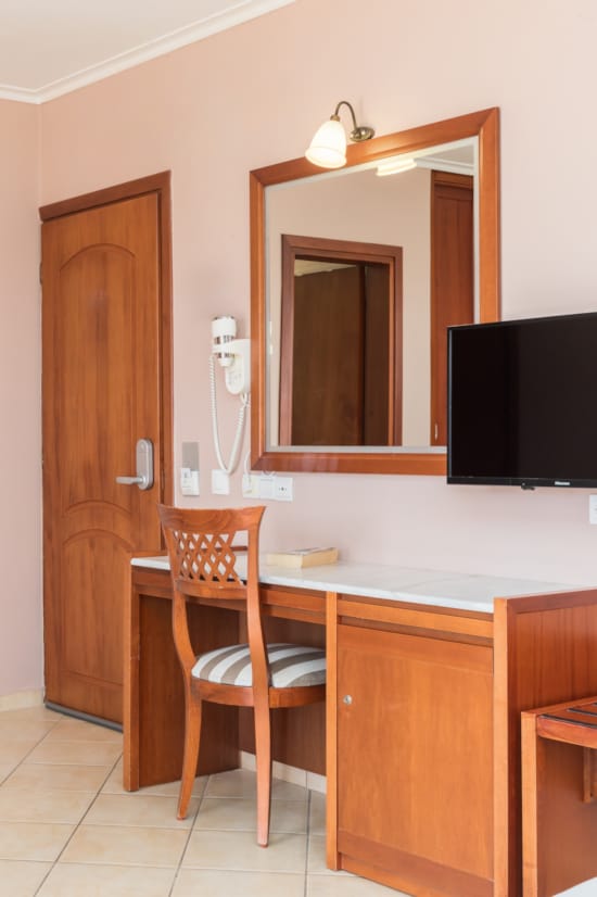 a room with a tv and a chair