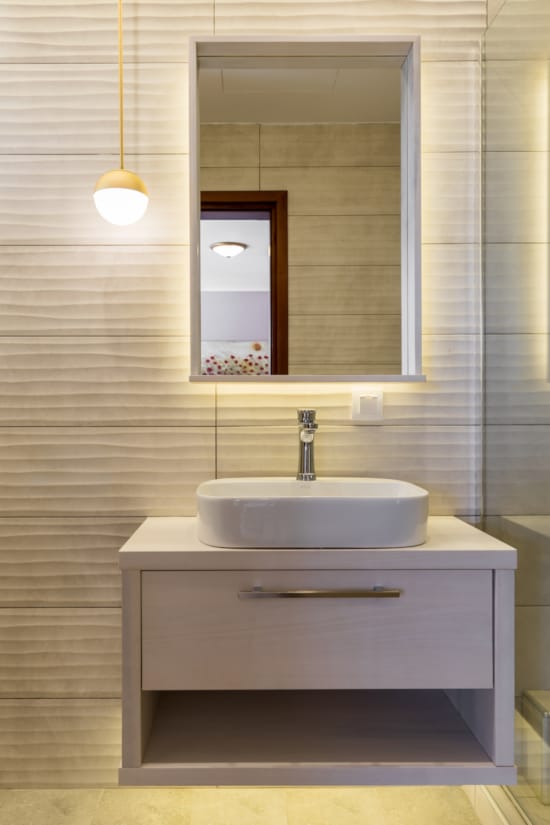 a bathroom with a mirror and sink