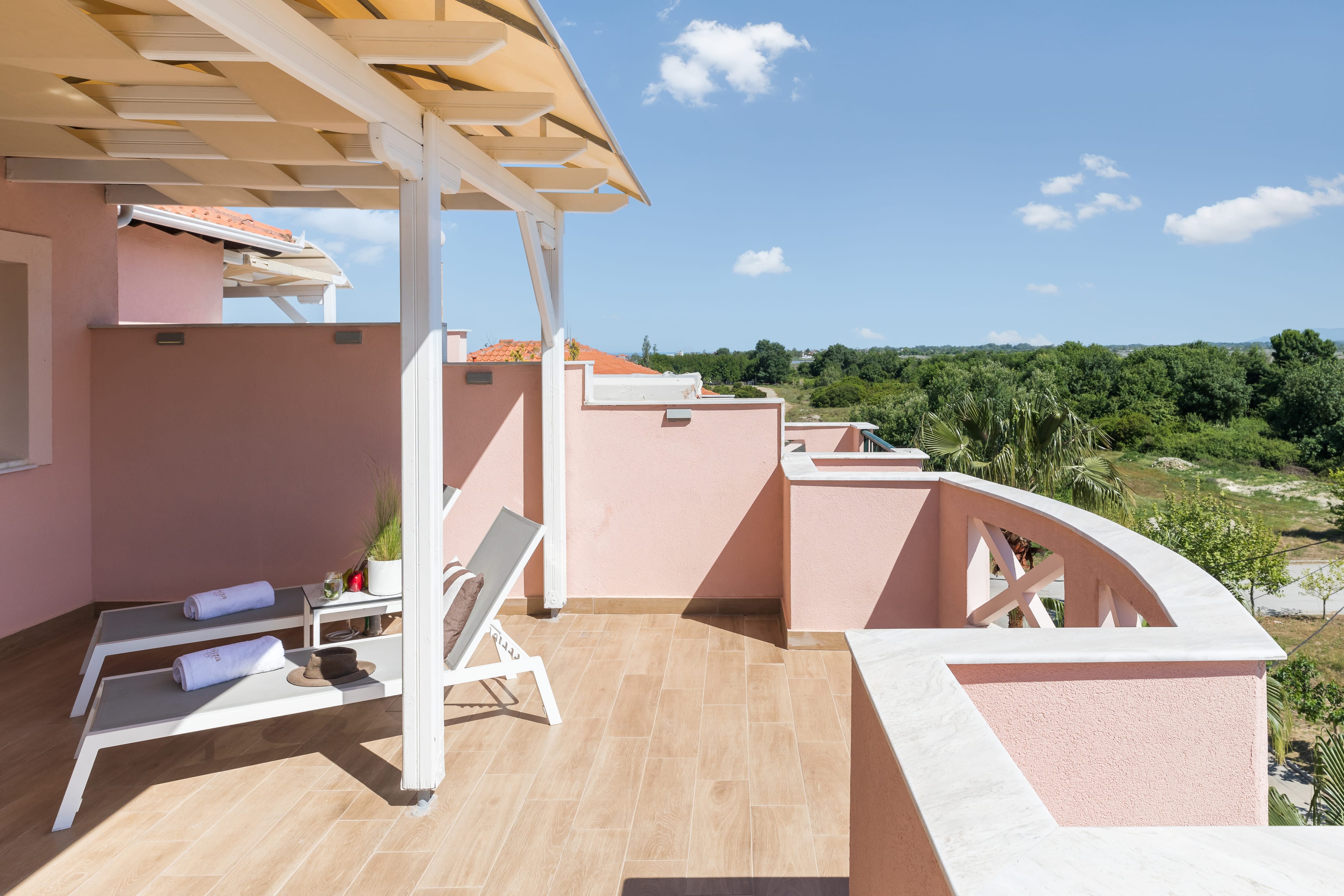 a deck with a deck and a house with trees in the background