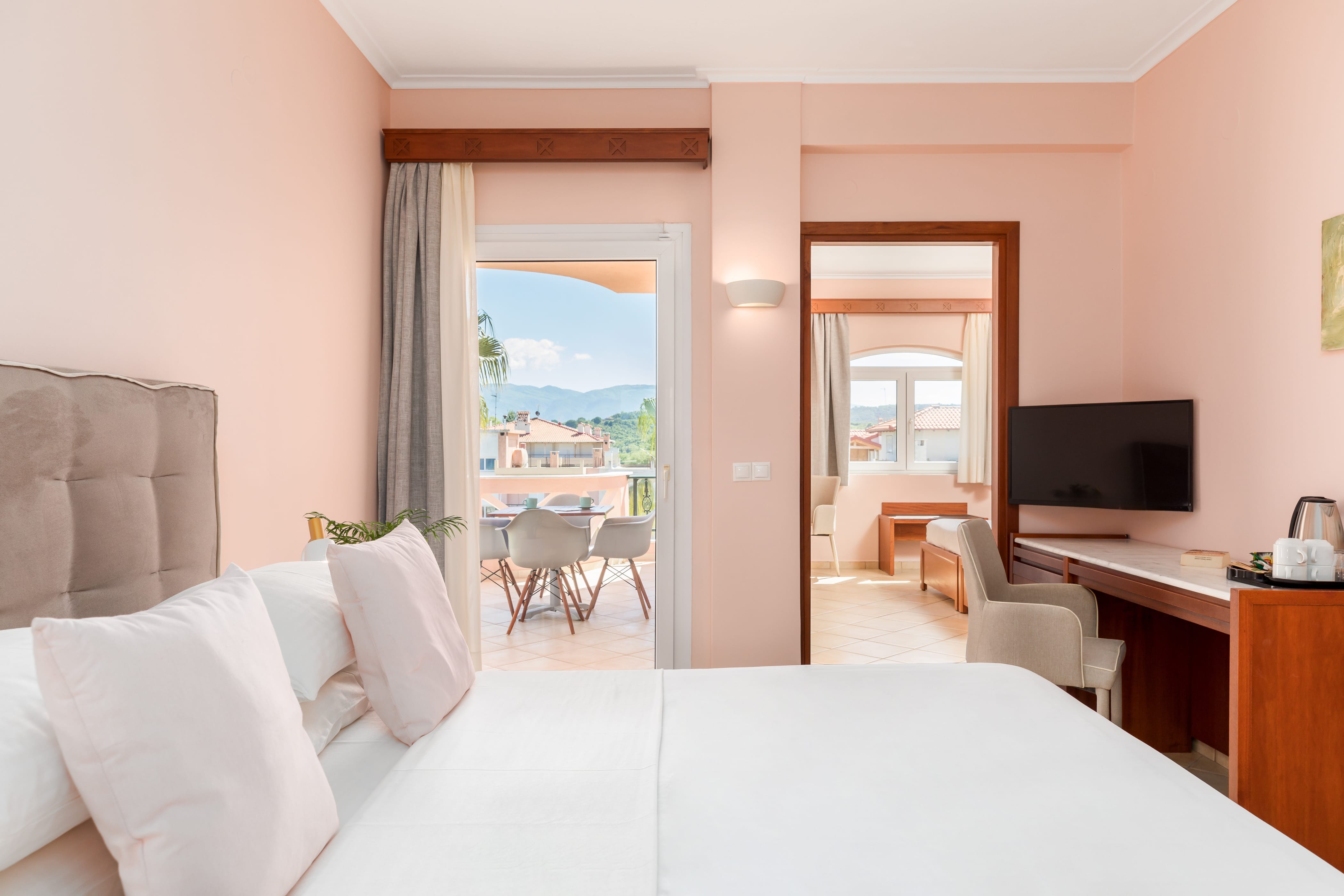 a room with a bed and a tv