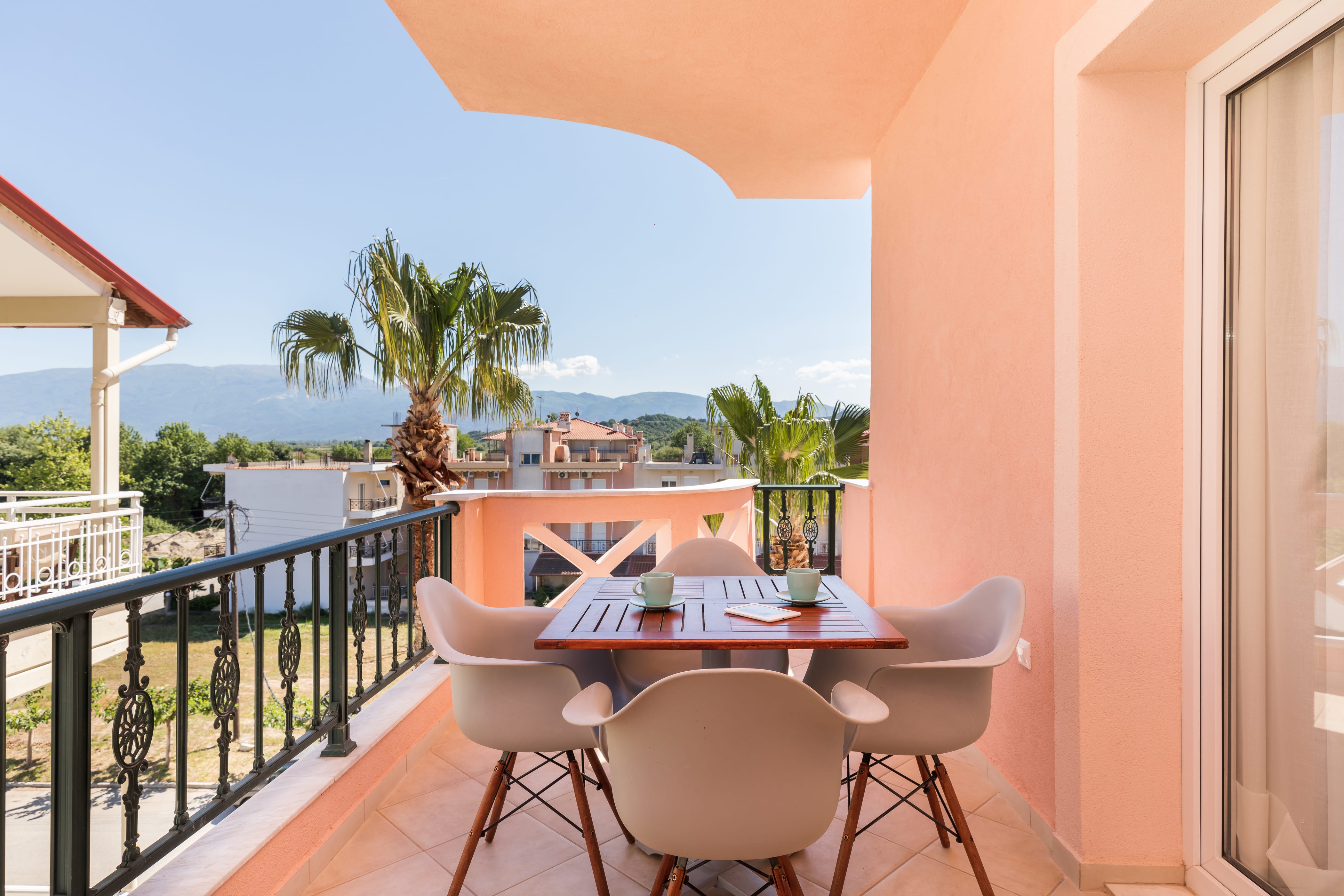 a table and chairs on a balcony