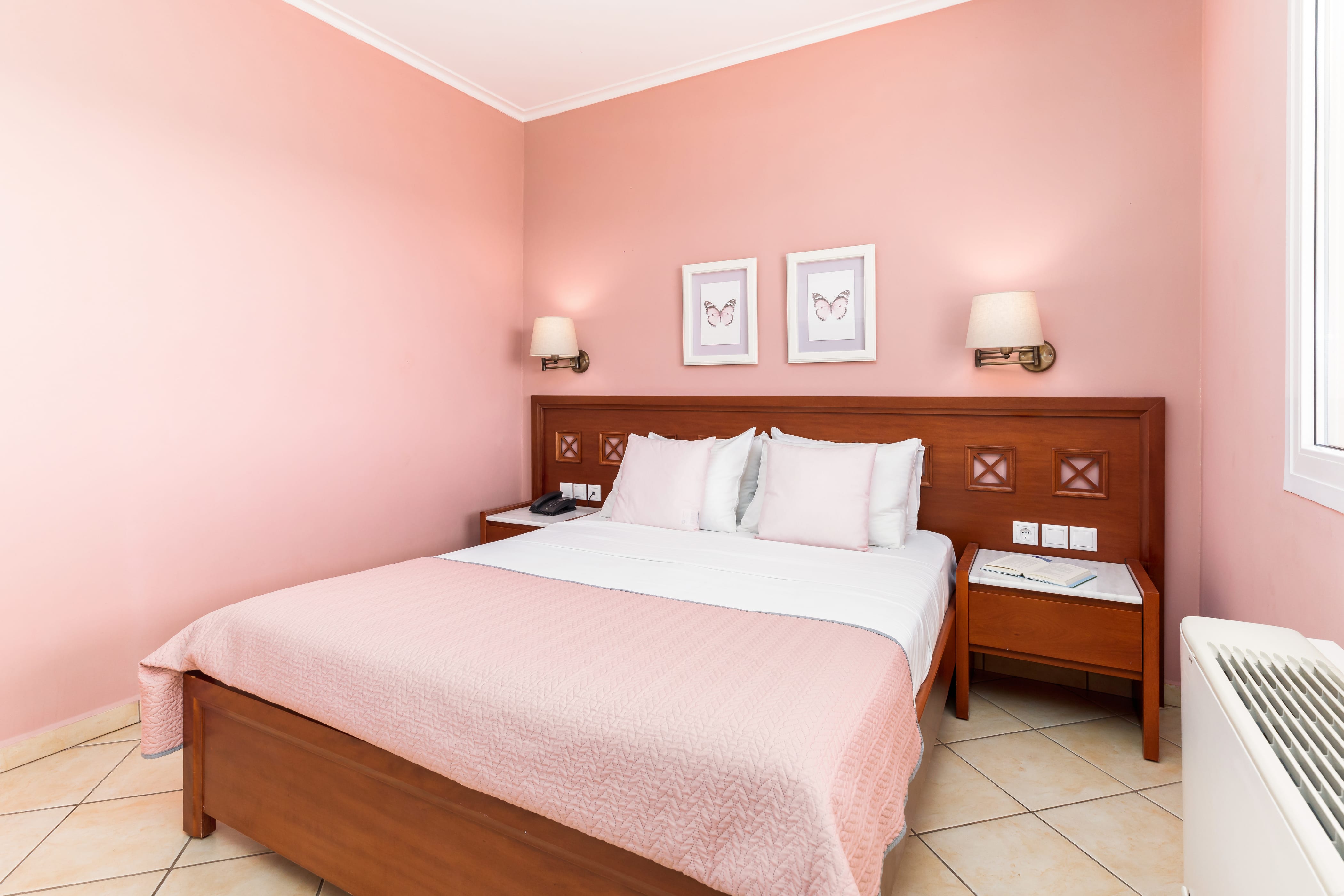 a bedroom with a bed and a bench