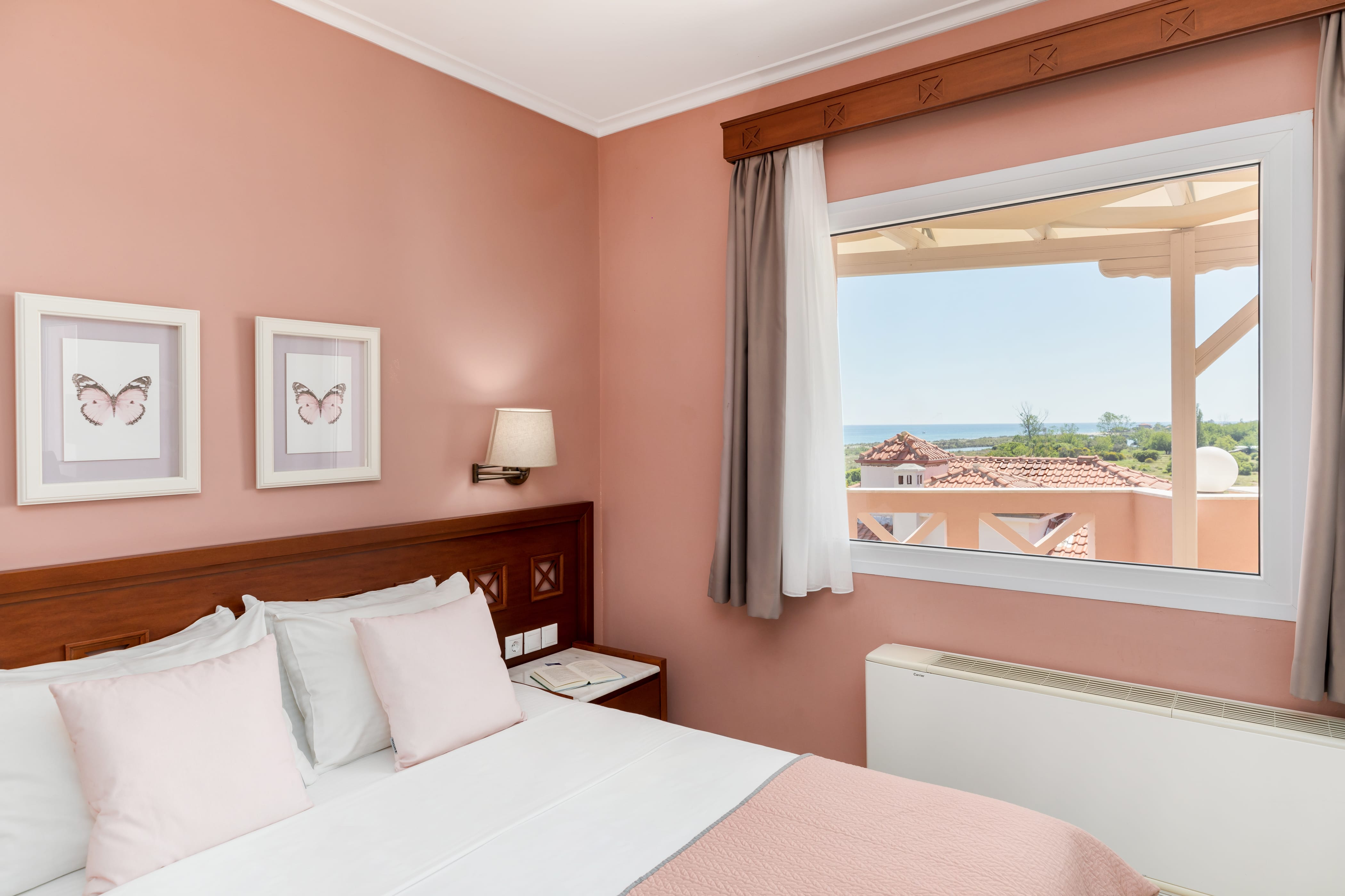 a bedroom with a large window