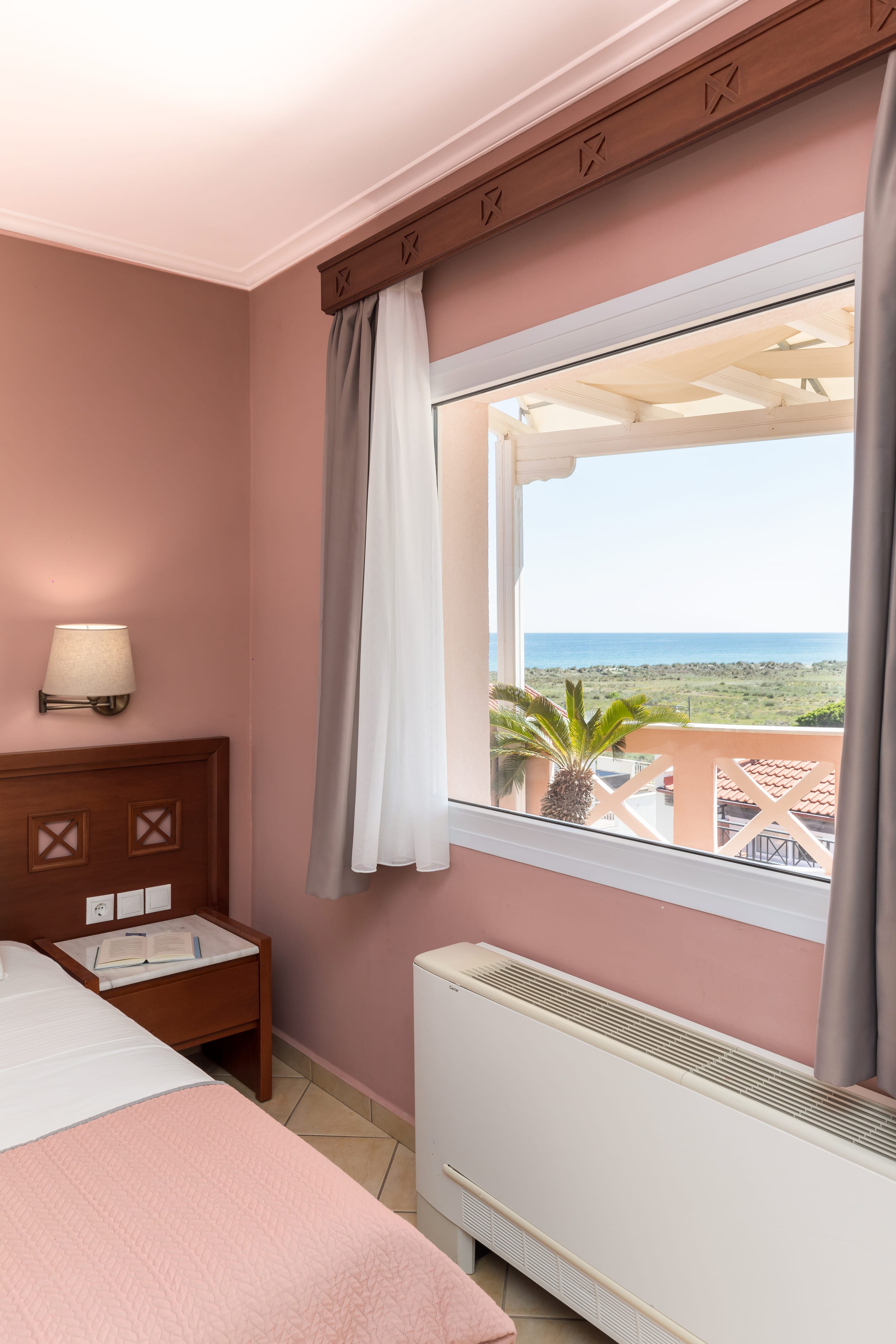 a bedroom with a large window