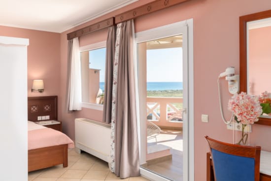 a bedroom with a large window