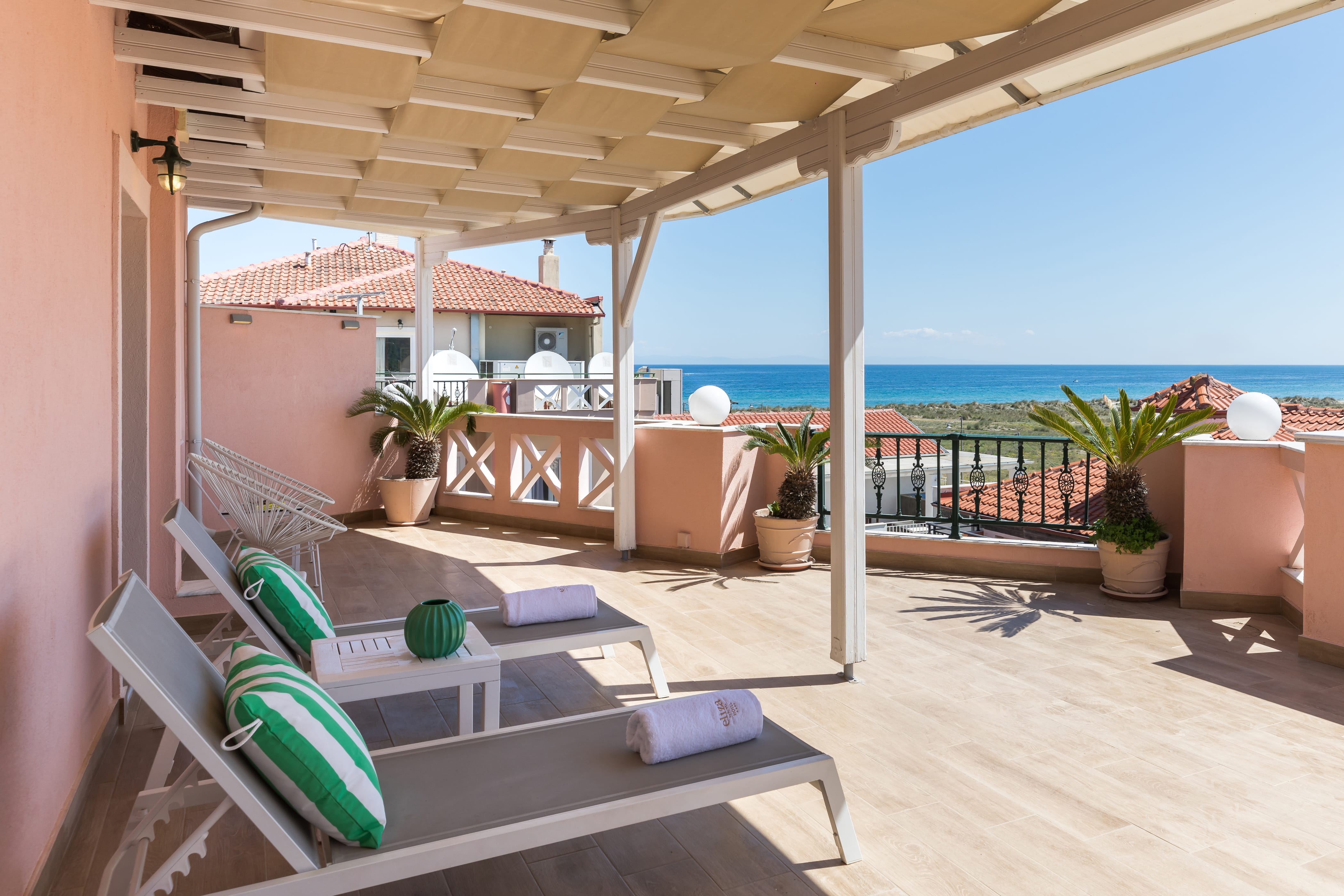 a room with a balcony and a pool