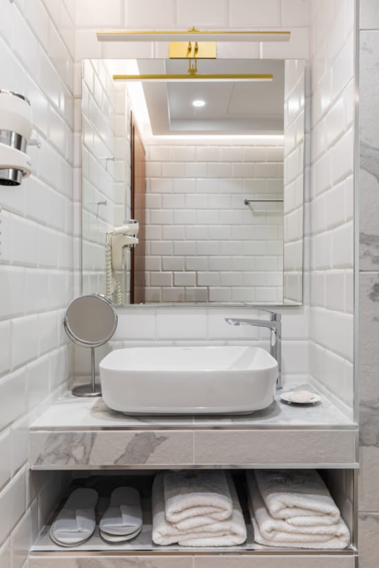 a bathroom with a sink and towels