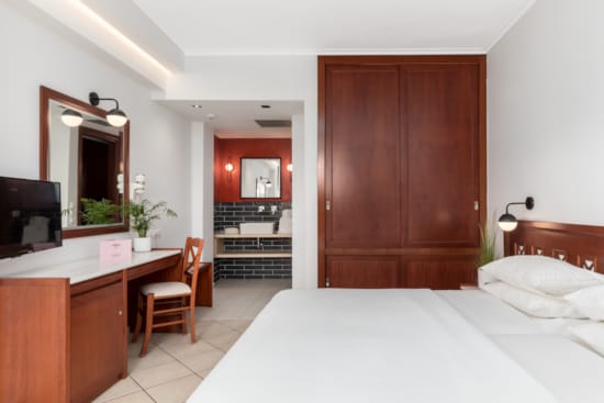 a bedroom with a bed and a desk