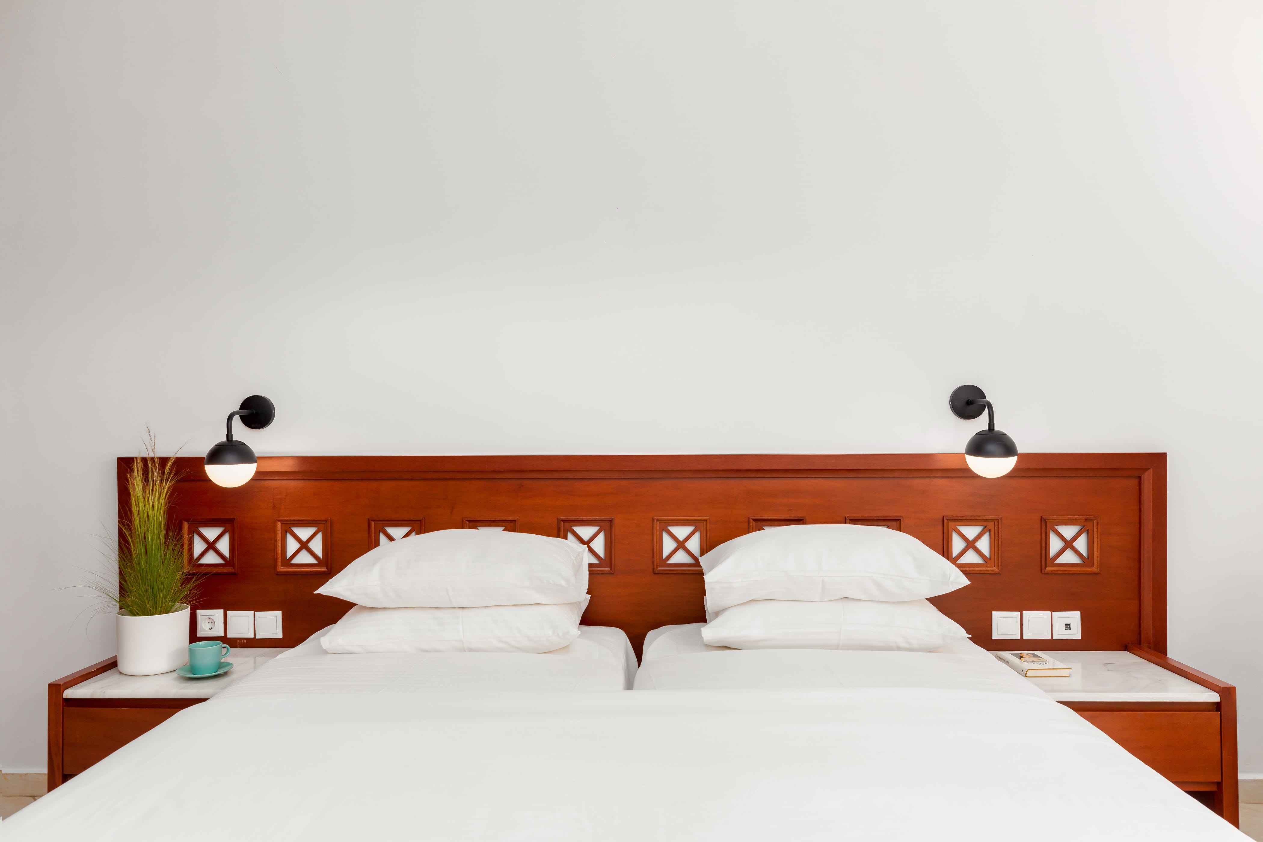 a bed with a white wall