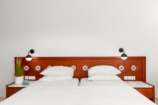 a bed with a white wall