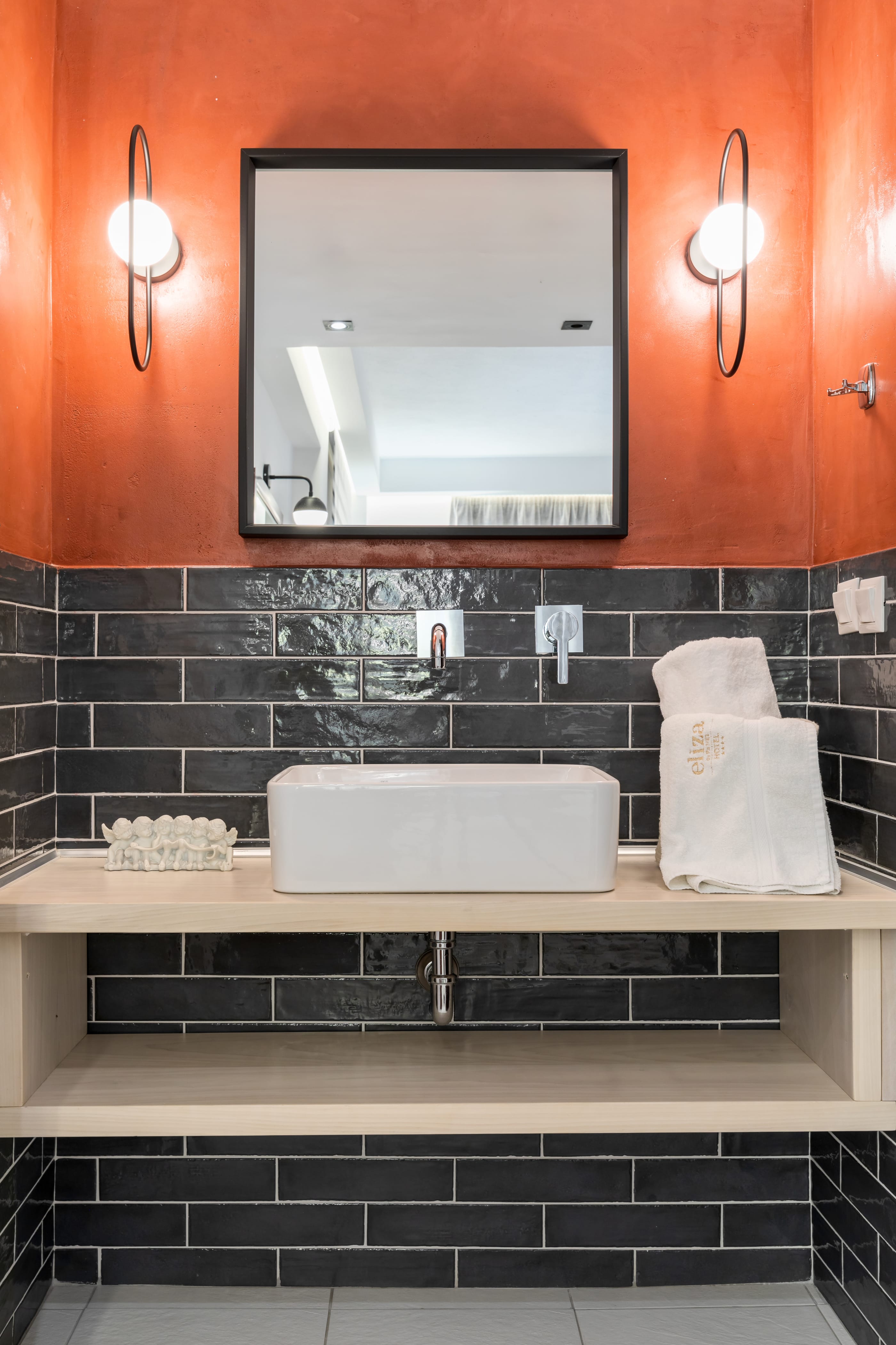 a kitchen with a mirror and a sink