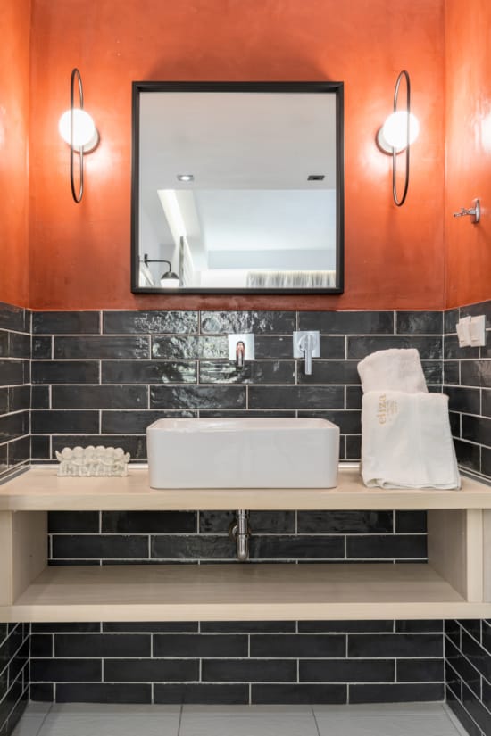 a kitchen with a mirror and a sink