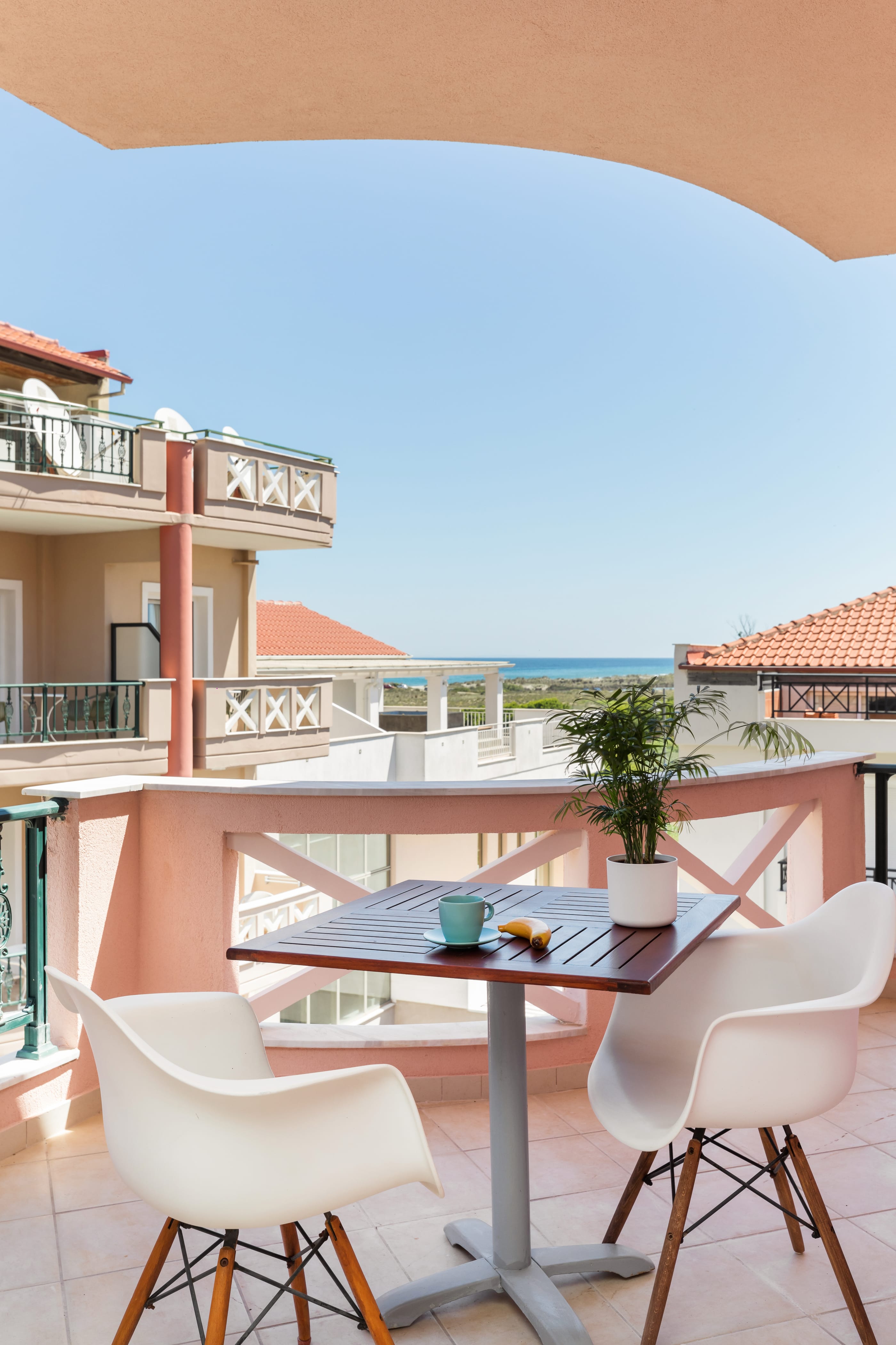a table and chairs on a balcony