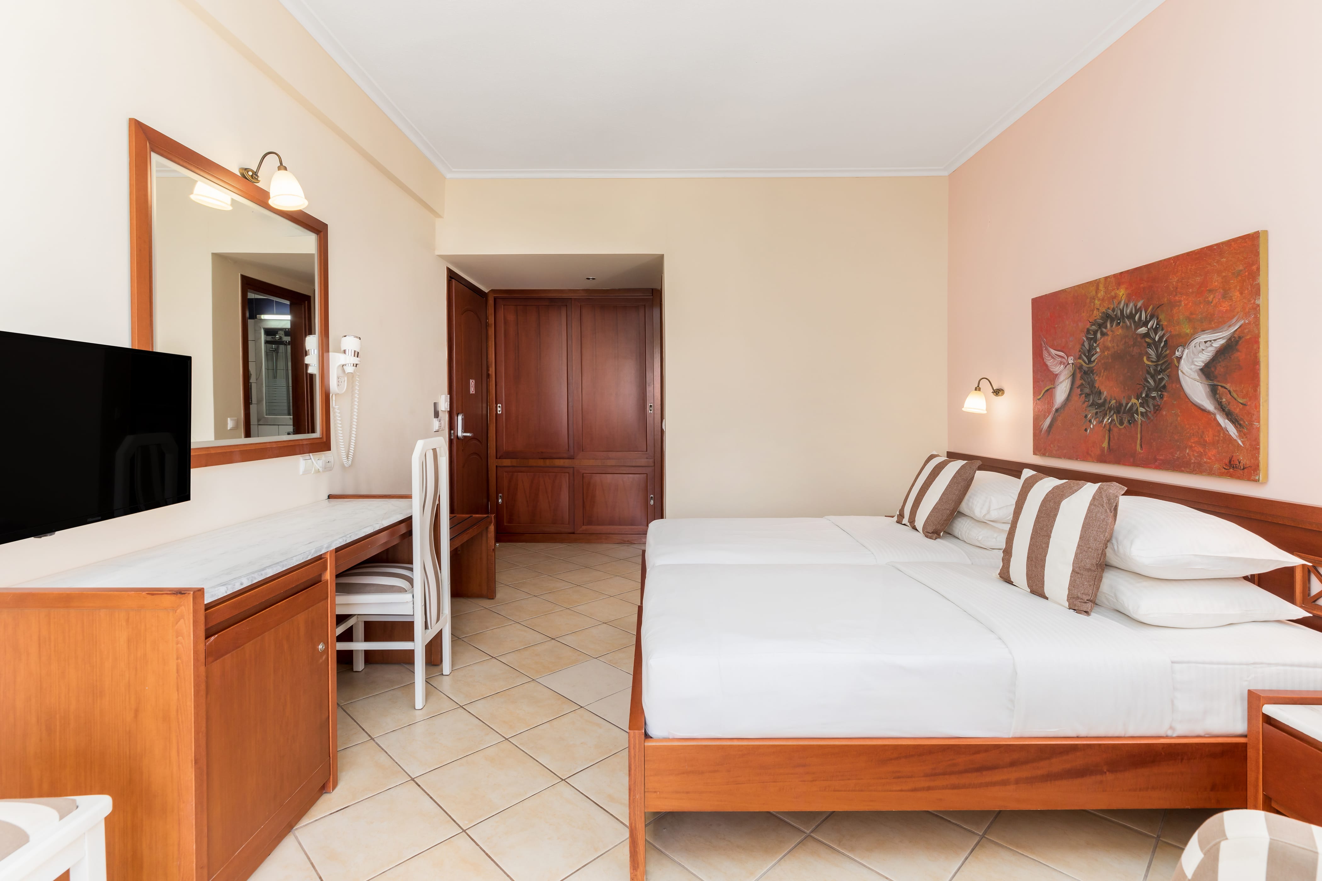 a bedroom with a bed and a tv