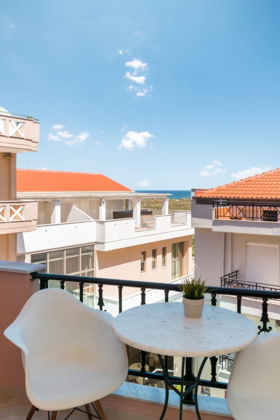 a table and chairs on a deck