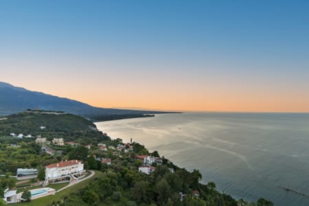 a beach with houses and trees