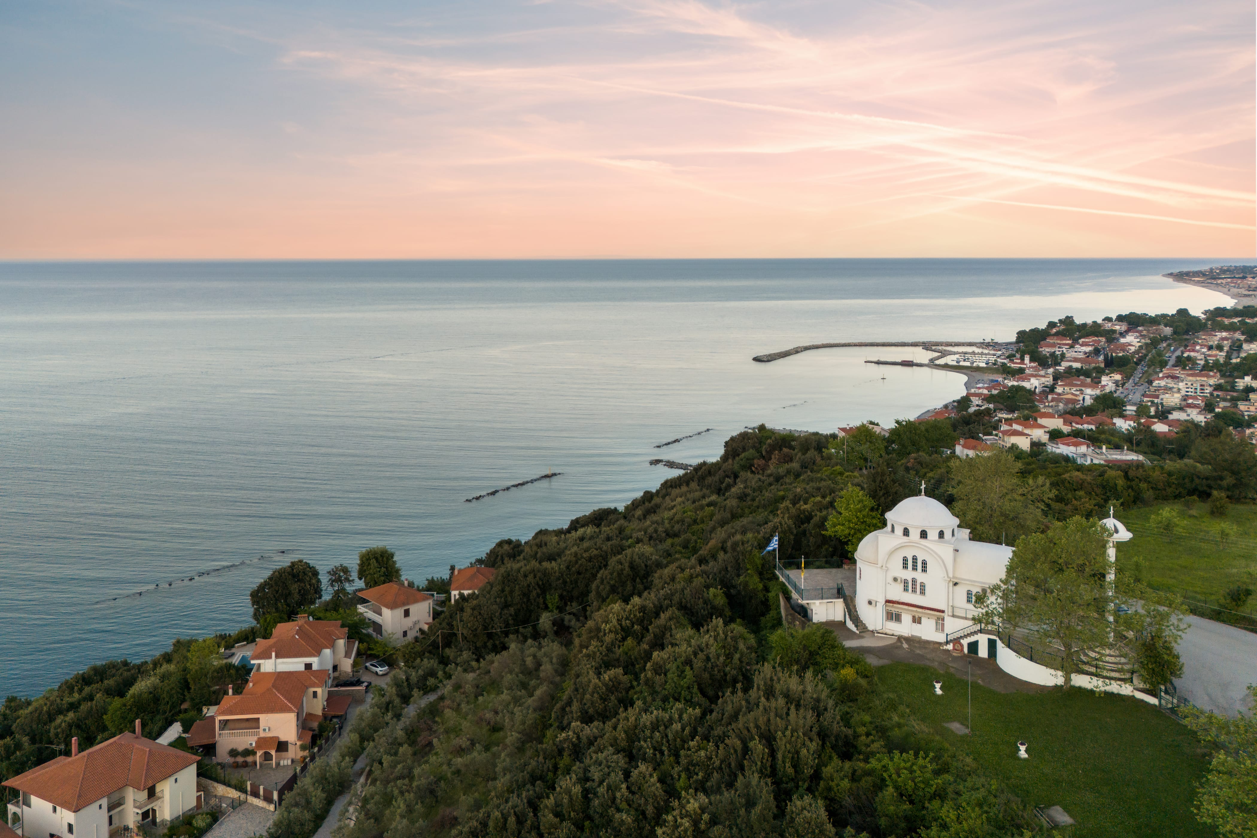 a town on a hill by the water